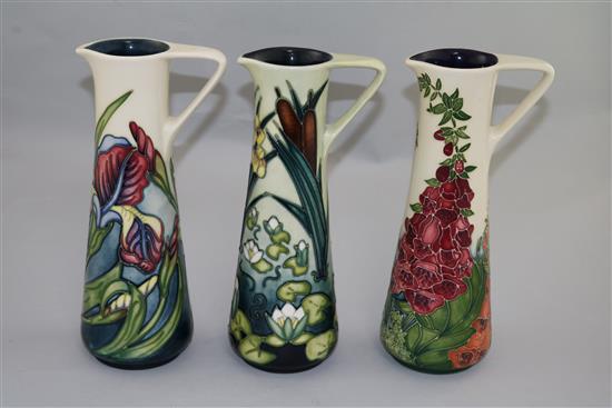 Three Moorcroft cylindrical ewers in Limia, Iris and Foxglove patterns, 1995-2002(-)